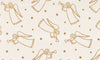 Ángeles y estrellas dorados navideños sobre fondo crema, 100 % algodón. Precio por yarda