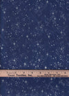 Cielo invernal: estrellas brillantes sobre fondo azul. 100 % algodón. Precio por yarda.