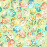 Huevos decorados para Pascua con motivos florales sobre fondo verde claro