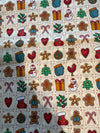 Mini bloques vintage navideños de pan de jengibre sobre fondo crema, 100 % algodón ligero. Precio por yarda.
