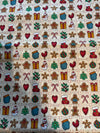 Mini bloques vintage navideños de pan de jengibre sobre fondo crema, 100 % algodón ligero. Precio por yarda.