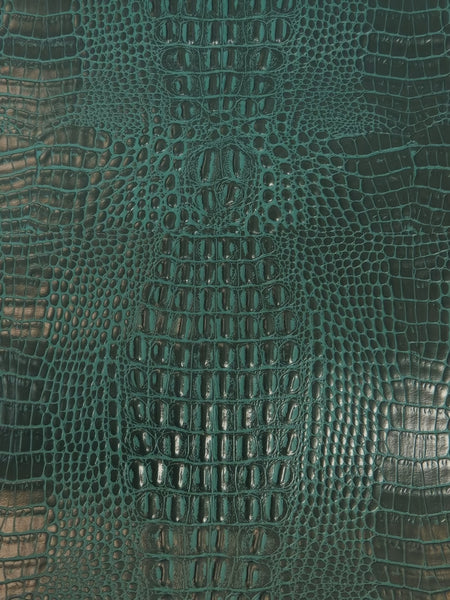 Tejido vinílico marino con estampado de cocodrilo en color verde azulado / Se vende por metros