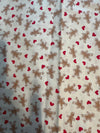 Mini estampado navideño vintage de galletas de jengibre y corazones sobre fondo crema, 100 % algodón ligero. Precio por yarda.