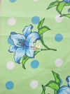 Tela de poliéster y algodón con estampado de lunares y campanillas verdes