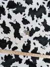 Tejido de velour de pelo corto con estampado de vaca en blanco y negro / Se vende por metros