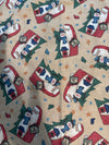Estampado navideño vintage con Papá Noel y un muñeco de nieve sobre fondo beige, 100 % algodón ligero. Precio por yarda.