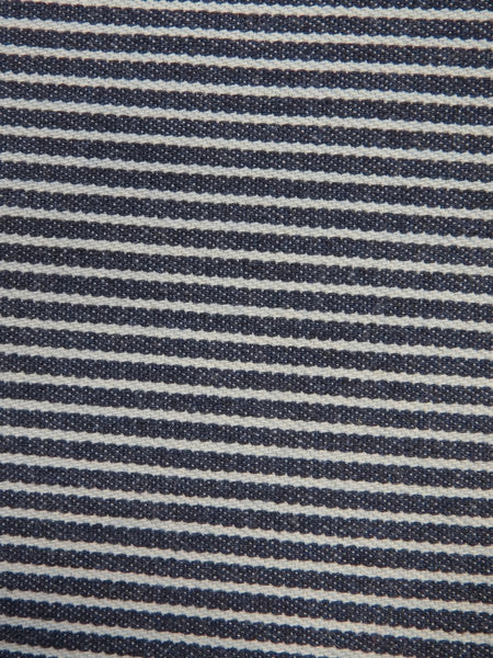 Tejido vaquero elástico de 9 oz en color natural con rayas azul marino