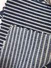 Tejido vaquero elástico de 9 oz en color natural con rayas azul marino