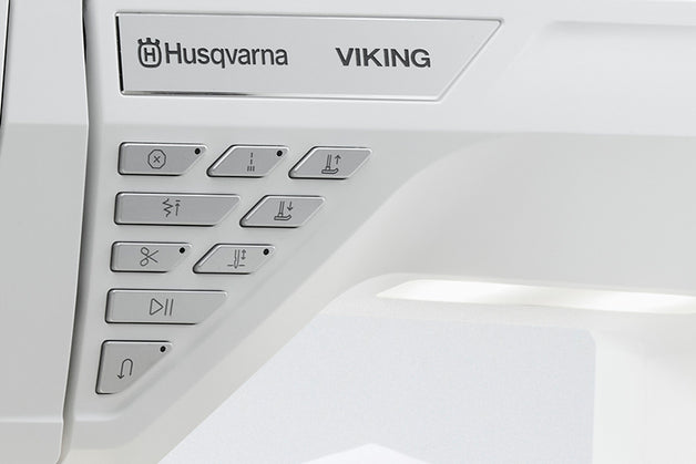 Control panel with Husqvarna Viking branding on a white background