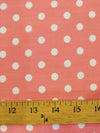 Tela estampada de poliéster y algodón con lunares pequeños / color chicle / lunares blancos / Se vende por metros