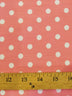 Tela estampada de poliéster y algodón con lunares pequeños / color chicle / lunares blancos / Se vende por metros