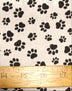 Tela de algodón y poliéster con estampado de patas de animales en blanco y negro