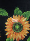 Tela de poliéster y algodón negra con estampado de girasoles