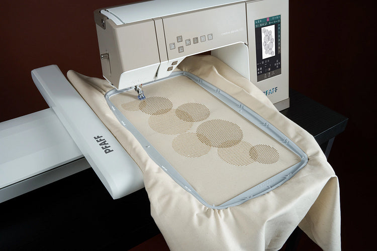 PFAFF creative elevate 680 sewing machine shown with additional embroidery unit