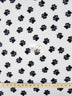 Tejido de felpa con estampado de huellas de animales en blanco y negro