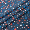 Tela SINGER®, 100 % algodón, estrellas patrióticas sobre fondo azul marino, se vende por metros