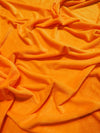 Tela Minky lisa de color naranja neón, suave al tacto / Se vende por metros