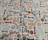 Tela con motivos de cachorros, 100 % algodón, color crema. Precio por yarda.