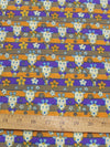Tela de poliéster y algodón con estampado de jirafas en color morado