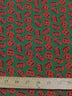 Tela de poliéster y algodón verde con motivos de calabazas de Halloween