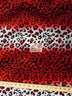 Tela de felpa de pelo corto con estampado de leopardo en rojo y blanco / Se vende por metros