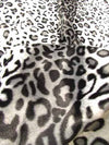 Tela de felpa de pelo corto con estampado de leopardo en rojo y blanco / Se vende por metros