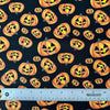 Tela de algodón 100 % con calabazas alegres de Halloween sobre fondo negro